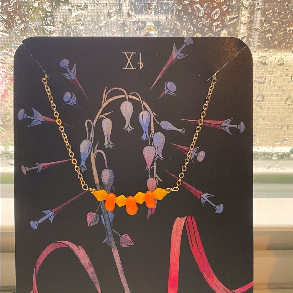 NWT yellow/orange porcelain beads on gold findings. Delicate with a statement.